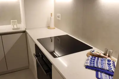 a kitchen with a sink and a counter top at Belgrade Waterfront Quartet 3 in Belgrade