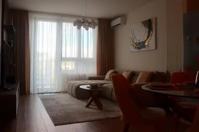 a living room with a couch and a table at Belgrade Waterfront Quartet 3 in Belgrade