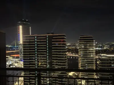 a view of a city at night with tall buildings at Beograd na vodi Belgrade waterfront - 23th floor, great view apartment in Belgrade