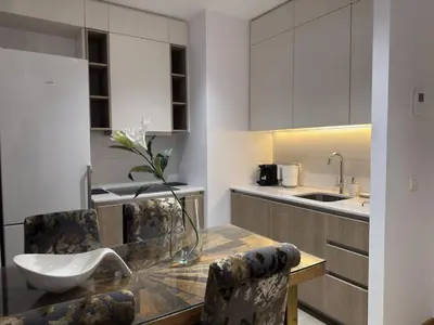 a kitchen with a table with a bowl on it at Beograd na vodi Belgrade waterfront - 23th floor, great view apartment in Belgrade