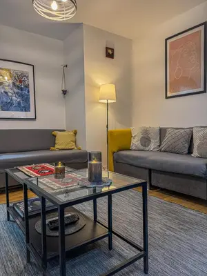 a living room with a couch and a table at Vista Dorćol - Old Town - Heart of Belgrade in Belgrade