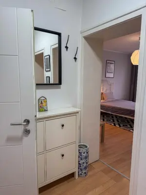 a room with a mirror and a dresser and a bedroom at Vista Dorćol - Old Town - Heart of Belgrade in Belgrade