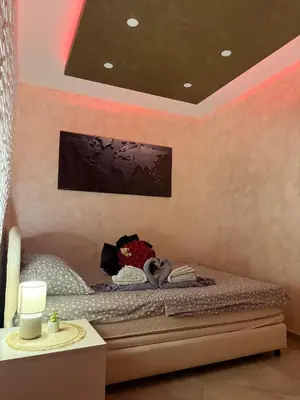 a bedroom with a bed with two hearts on it at Centar Lux Obrenovac, Na Trgu, Siguran Parking in Obrenovac