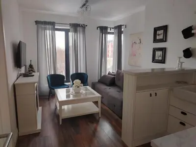a living room with a couch and a table at Benvenuti SUN in Belgrade
