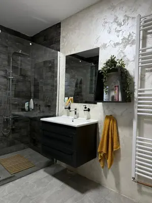 a bathroom with a sink and a shower at Barrique apartments sa zatvorenim bazenom in Smederevo