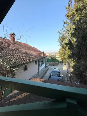a car parked in front of a house at Barrique apartments sa zatvorenim bazenom in Smederevo