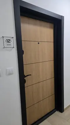 a garage door with a clock on it at Apartman Simić in Smederevo