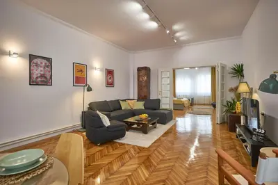a living room with a couch and a table at Take One in Belgrade