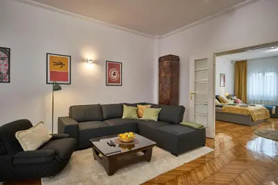a living room with a couch and a table at Take One in Belgrade