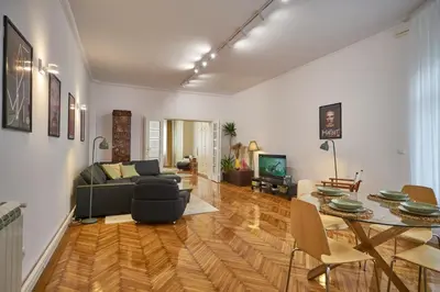 a living room with a couch and a table at Take One in Belgrade