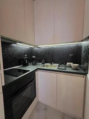a kitchen with a sink and a counter top at Sotto Il Sole in Surčin