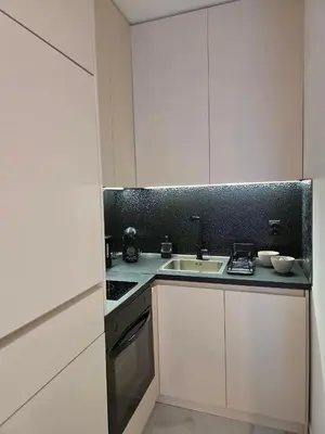 a kitchen with a sink and a counter top at Sotto Il Sole in Surčin
