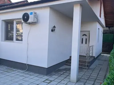 a house with a air conditioner on the side of it at Apartman Tas in Smederevo
