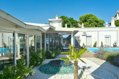a house with a courtyard with a swimming pool at Apartments Villa Graf in Smederevo