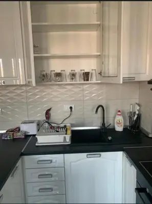 a kitchen with a sink and a counter top at Royal Residence aprtamani Aviv in Pančevo