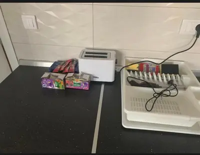 a desk with a box of office supplies on it at Royal Residence aprtamani Aviv in Pančevo