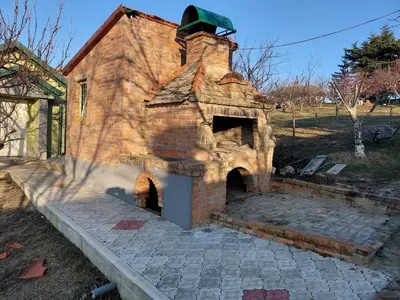 an old brick oven sitting on a patio at Ranč Petar Alavanja Banstol in Sremski Karlovci