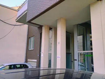 a car parked in front of a building at H1trece in Belgrade