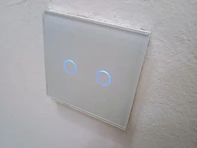 a white panel on a wall with two speakers at H1trece in Belgrade
