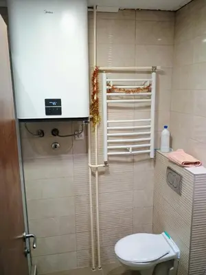a small bathroom with a toilet and a shower at H1trece in Belgrade