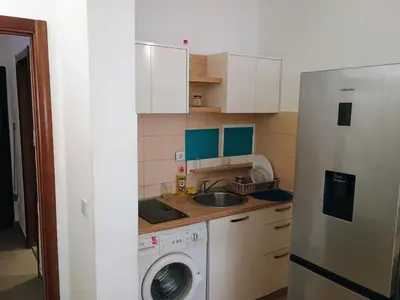 a kitchen with a washing machine and a sink at H1trece in Belgrade