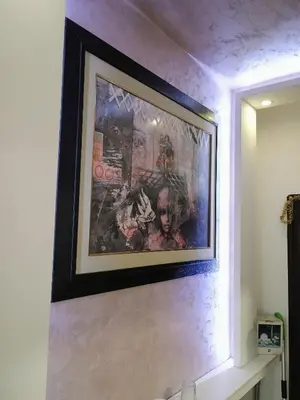 a picture hanging on a wall in a bathroom at H1trece in Belgrade