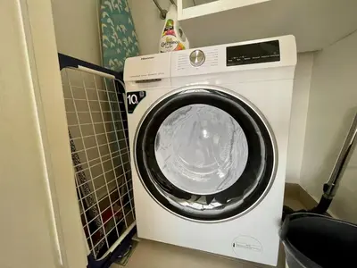 a washing machine is sitting in a room at Romantic One Bedroom Home at BW-City and Park View in Belgrade
