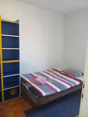 a bedroom with a bunk bed with a pink hat on it at Apartman86 in Beograd