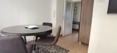 a dining room with a table and chairs in a room at Two Bedroom Apartment Obilicev Venac in Belgrade