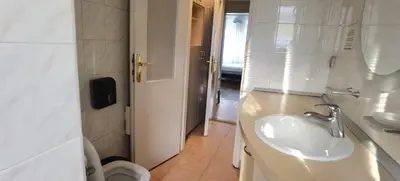 a bathroom with a sink and a toilet at Two Bedroom Apartment Obilicev Venac in Belgrade