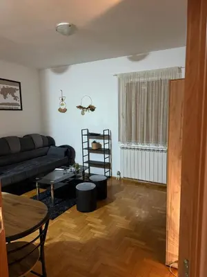 a living room with a couch and a table at Barbello in Stara Pazova
