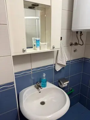 a bathroom with a sink and a mirror at Barbello in Stara Pazova