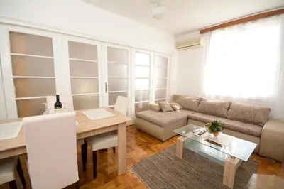 a living room with a couch and a table at Apartments City Hall in Belgrade