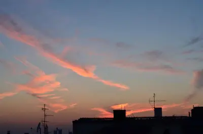 a view of a sunset with clouds in the sky at casa CIUK in Belgrade