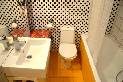 a bathroom with a sink and a toilet and a tub at casa CIUK in Belgrade
