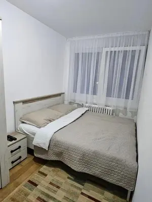 a bedroom with a bed and a window at No 104 7 Residance in Belgrade