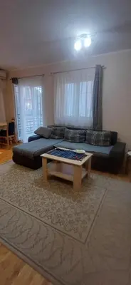 a living room with a couch and a coffee table at Jelena's place in Belgrade