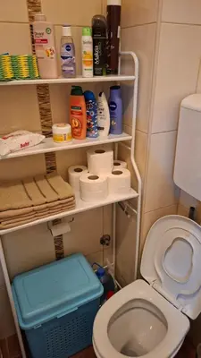 a bathroom with a toilet and a bunch of toiletries at Jelena's place in Belgrade