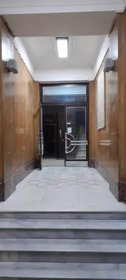 an empty hallway with stairs leading to a door at Flat center of Belgrade in Belgrade