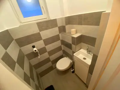 a small bathroom with a toilet and a sink at Flat center of Belgrade in Belgrade