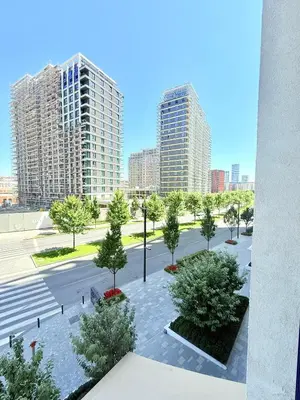a view of a park with trees and buildings at Eden Apratment in Belgrade