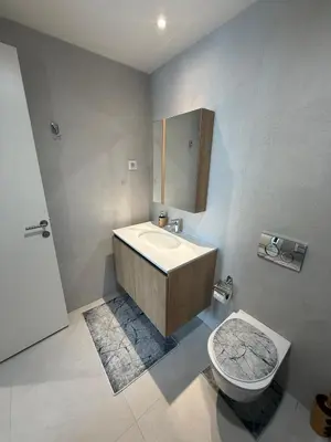 a bathroom with a sink and a toilet at Eden Apratment in Belgrade