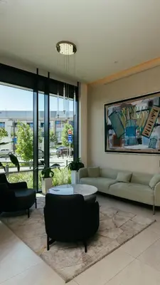 a living room with a couch and a table at BW Sole Presidential Suite in Belgrade