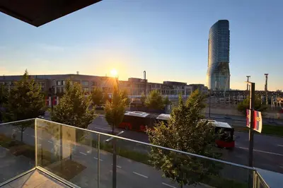 a view of a city with buses in a parking lot at BW Sole Presidential Suite in Belgrade