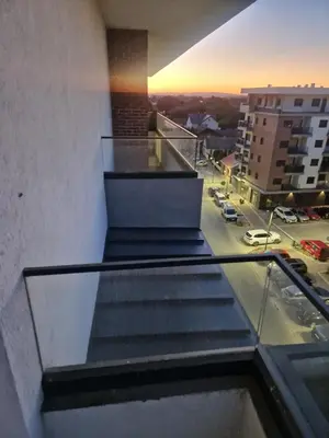 an escalator in a building with a view of a city at Apartman Oskar Dunav in Stari Banovci