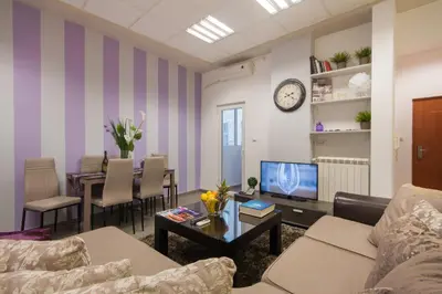 a living room with a couch and a table at Apartment Vukanja in Belgrade