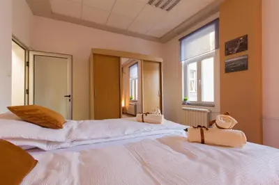 two beds in a room with two bags on them at Apartment Vukanja in Belgrade