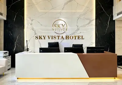 a reception desk in a lobby with a sky vista hotel at Sky Vista Hotel in Ledine