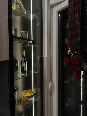a stainless steel refrigerator in a kitchen with christmas decorations at DUMA Apartmani Arandjelovac in Arandjelovac