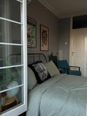 a bedroom with a bed and a window at Cozy Apart Central Oasis in Belgrade